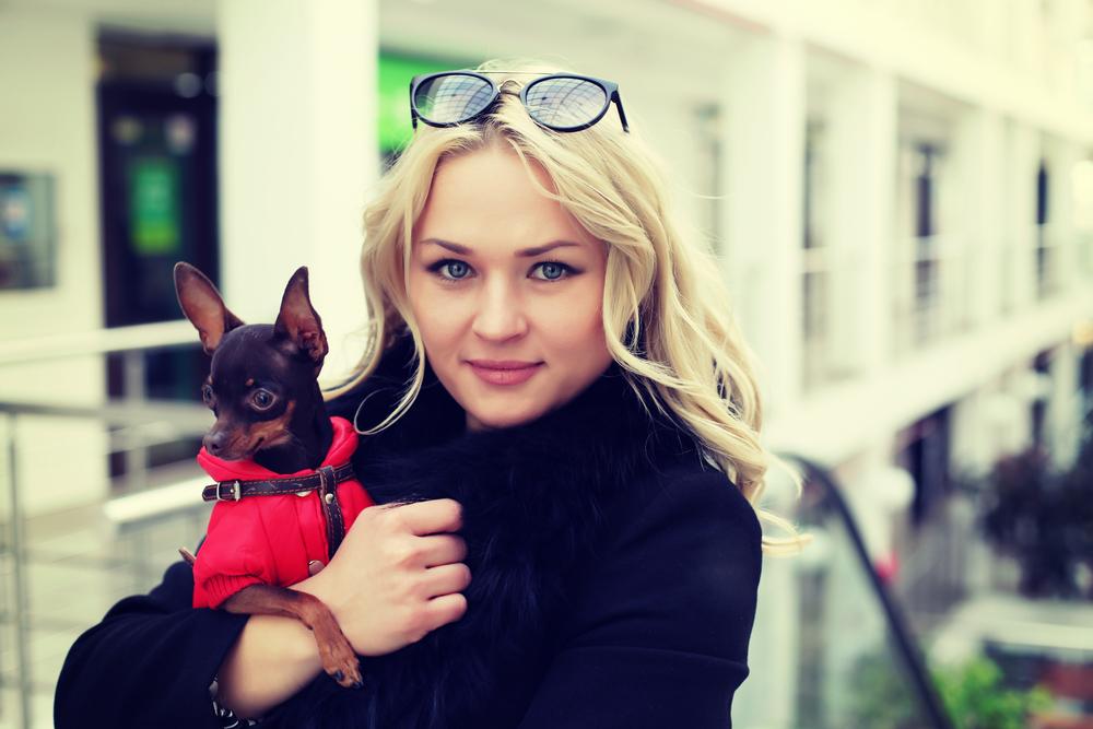 Stylish woman with her dog.