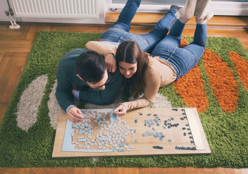 Couple doing jigsaw puzzle