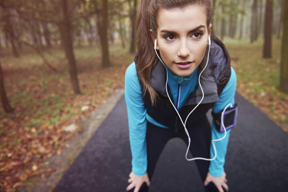 Woman running in woods