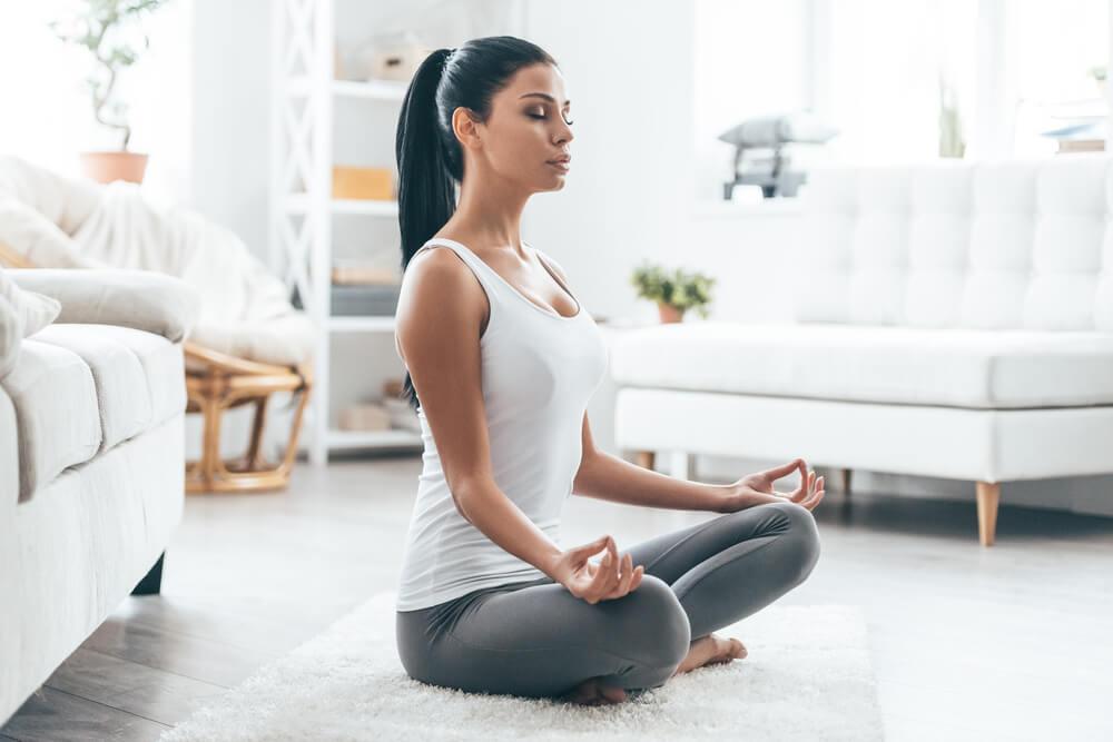 Woman meditating at home