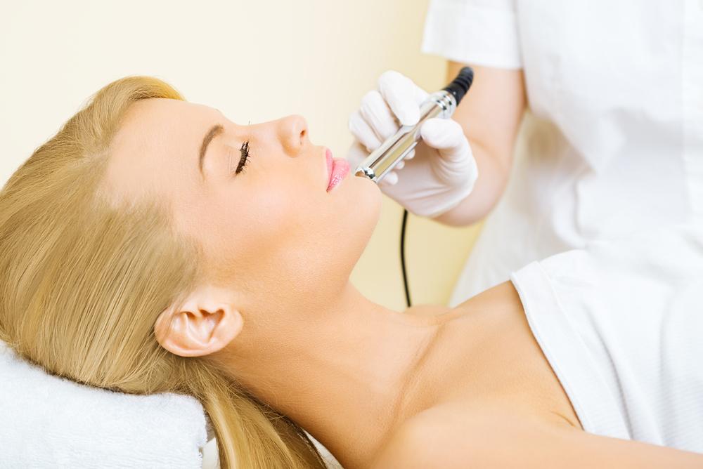 Woman getting a microdermabrasion treatment