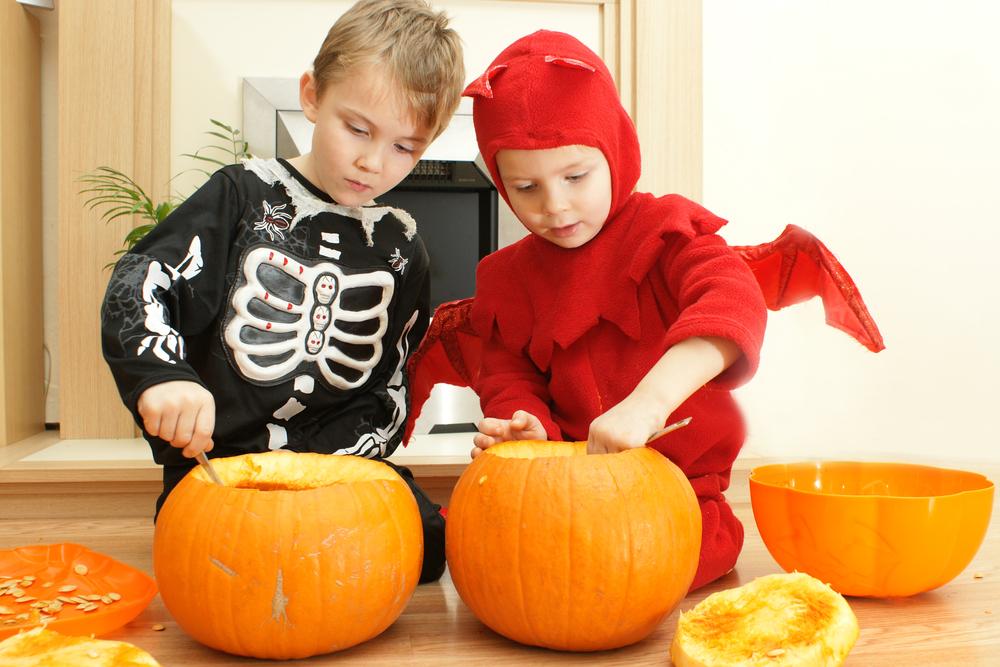 Young kids preparing for Halloween.