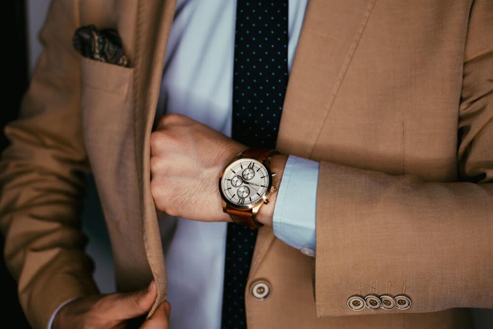 Man wearing suit and watch