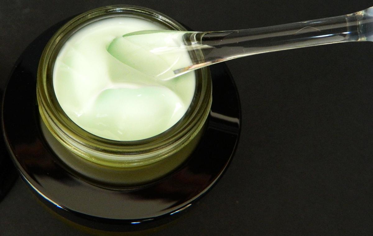 Applicator in jar of cream