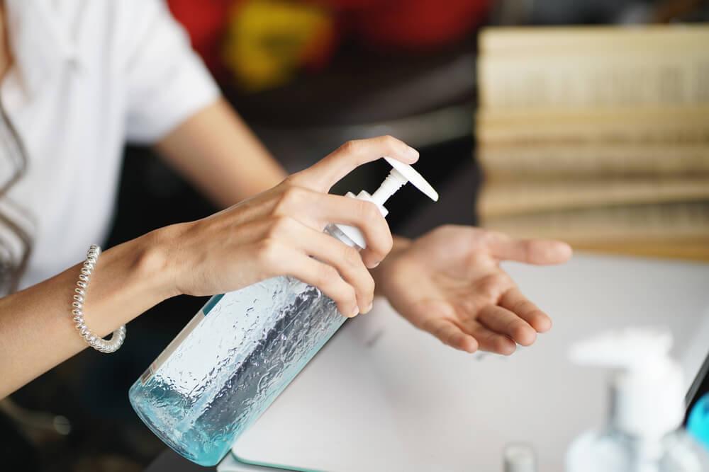 Woman using DIY hand sanitizer