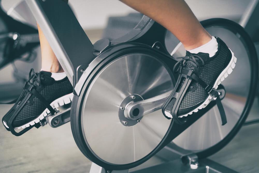 Feet cycling on exercise bike