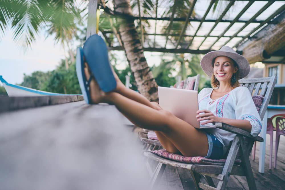 Woman working under palm tree