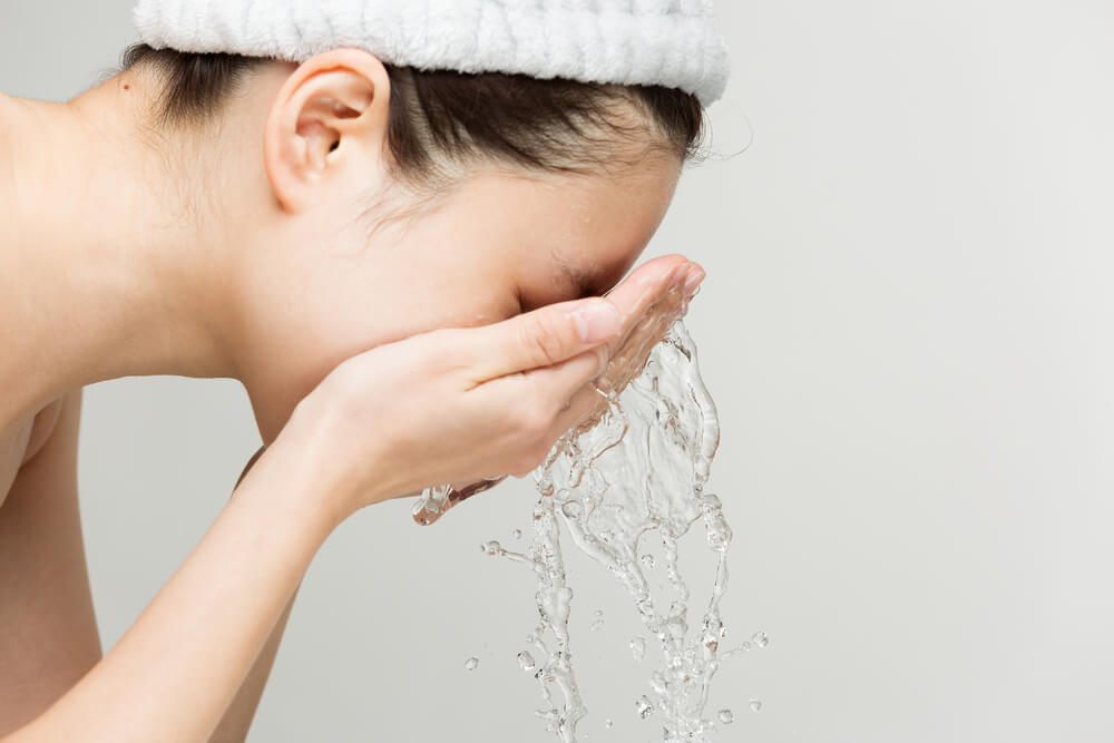 woman washing face