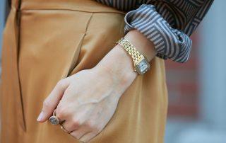 Woman wearing gold Cartier watch