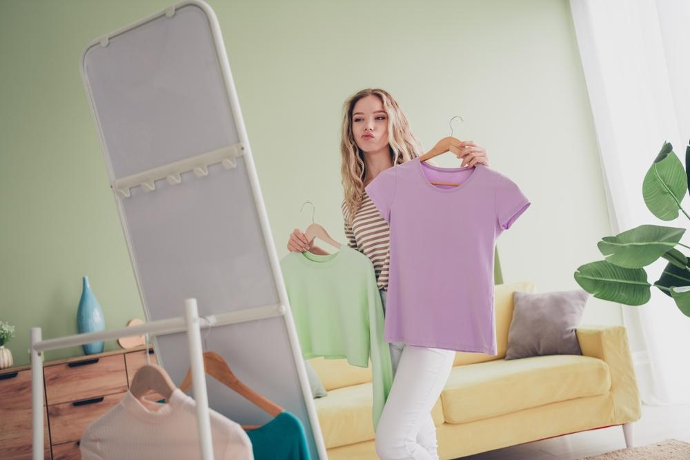Woman choosing which clothing colors will boost her dopamine