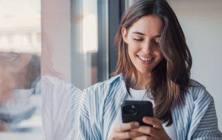 Woman choosing from productivity apps on her phone