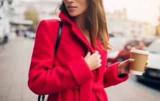 Woman wearing red statement outerwear